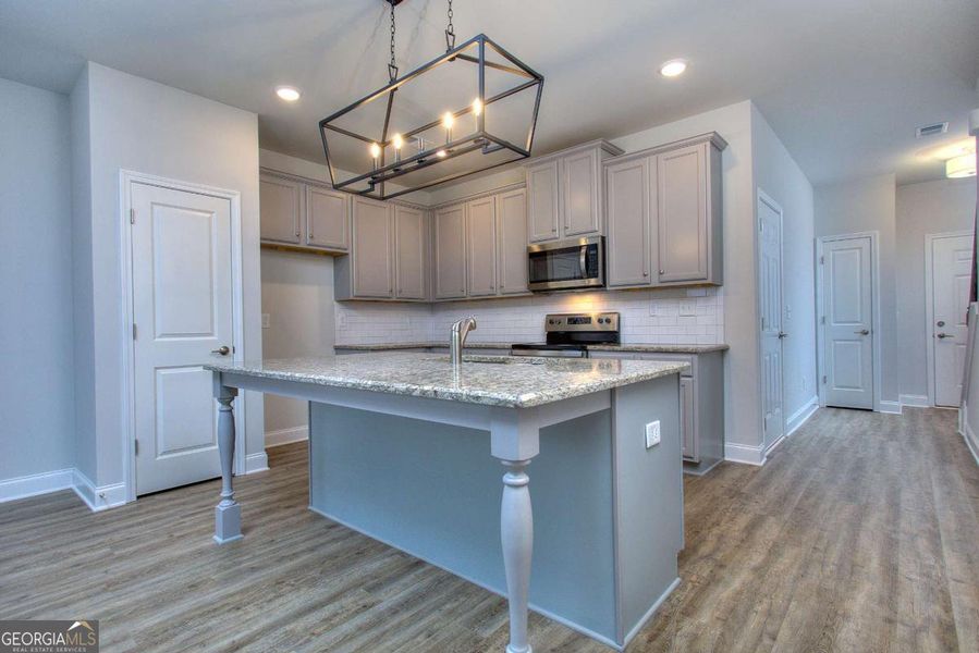 Furnished interior view inside a new home in Chimney Oaks Townhomes, Homer (Image 4).