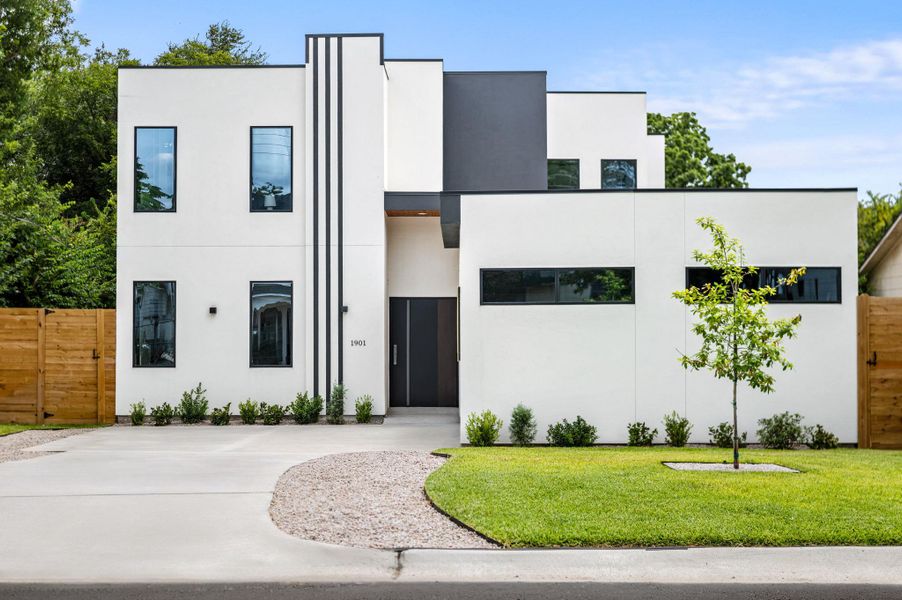 Bold contemporary architecture distinguishes this crisp, multi-level home with striking lines and an inviting entry. Bold contemporary architecture distinguishes this crisp, multi-level home with striking lines and an inviting entry.