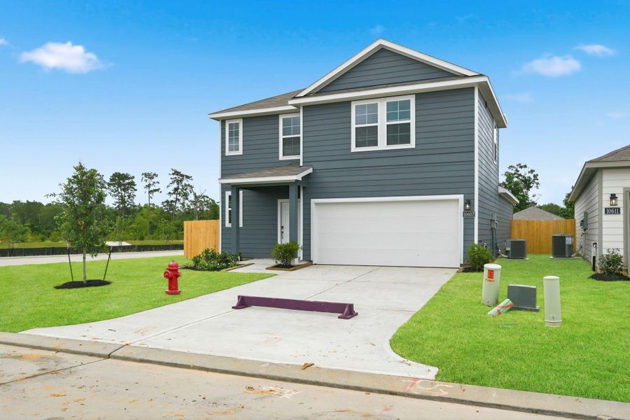 Front exterior of a new home in Crockett Meadows, Conroe, TX, highlighting curb appeal (Image 18).