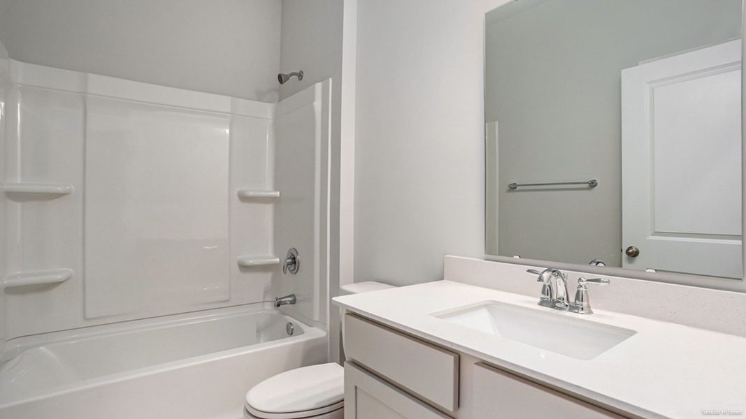 Representative furnished interior of a home built from the Delmont by D.R. Horton in Merchant Point, Jacksonville (Image 12).