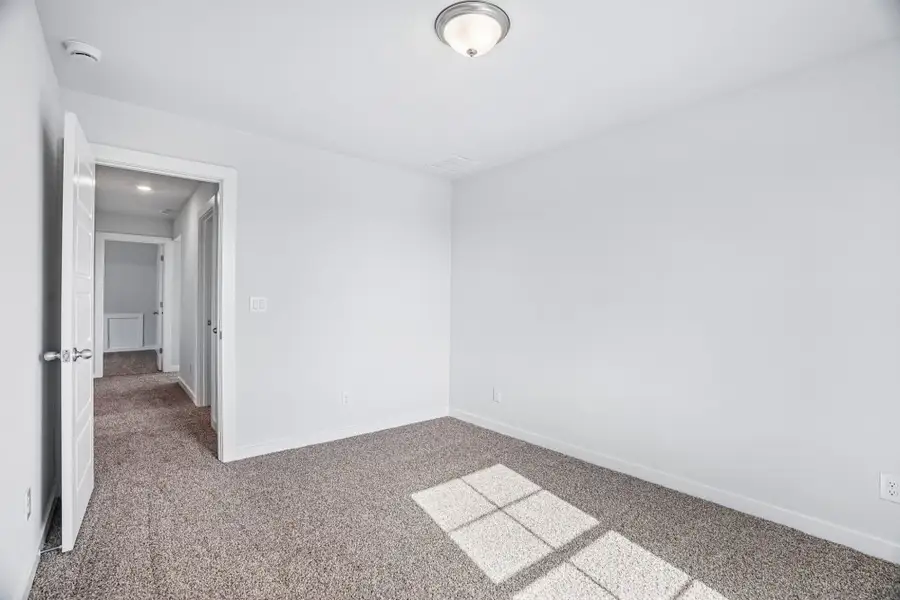 Spacious, unfurnished interior of a new home in The Meadows at Hunters Ranch, San Antonio (Image 33).