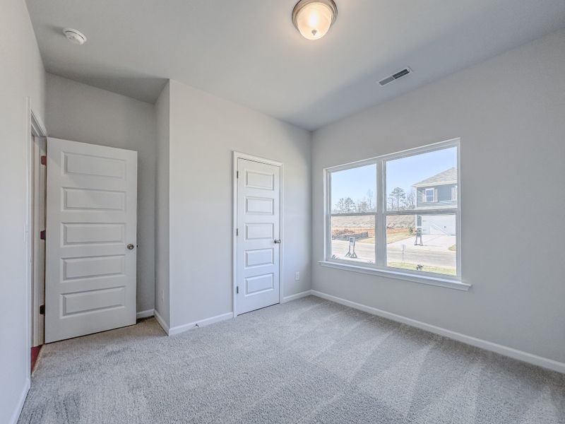 Representative unfurnished interior of a home built from the The Hampton by Smith Douglas Homes in Enclave at Willis, Willis (Image 15).