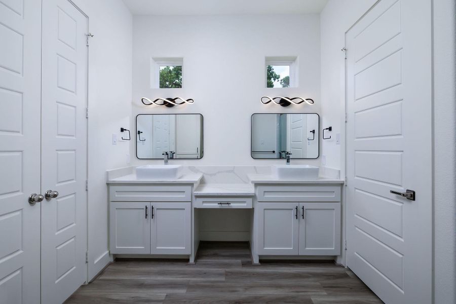 Primary bath  double sinks and cabinets