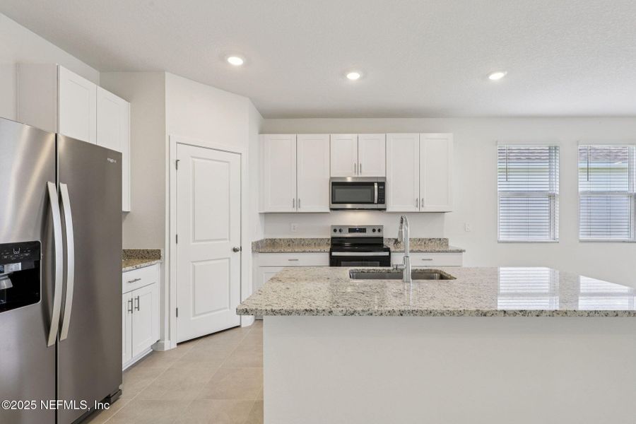Furnished interior view inside a new home in Lakes at Bella Lago - Signature Series, Green Cove Springs (Image 10). Furnished interior view inside a new home in Lakes at Bella Lago - Signature Series, Green Cove Springs (Image 10).