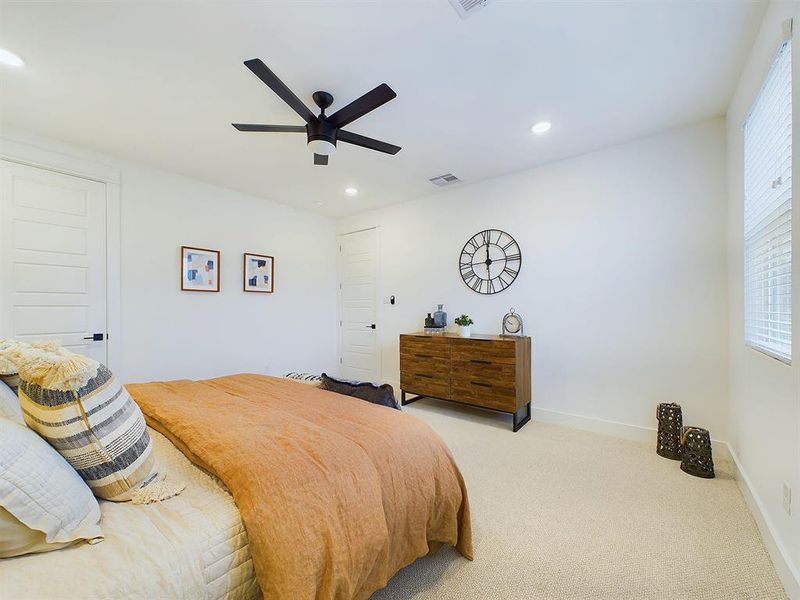 Elegant Primary Bedroom located on the 2nd floor. The high ceilings, with recessed lighting, are prewired and blocked for ceiling fans (not included).