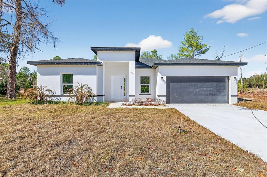 Front exterior of a new home in , Ocklawaha, FL, highlighting curb appeal (Image 1). Front exterior of a new home in , Ocklawaha, FL, highlighting curb appeal (Image 1).
