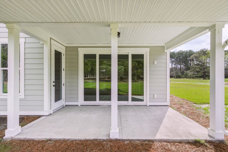 Exterior details and patio area of a home in , Johns Island (Image 33).