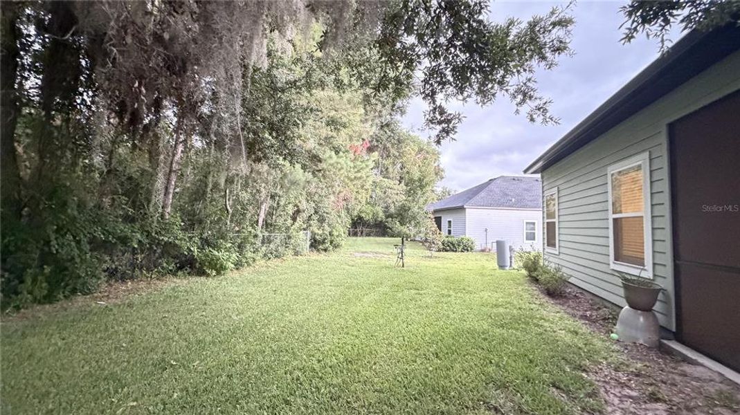 Exterior details and patio area of a home in Grand Park North, Dunnellon (Image 17).