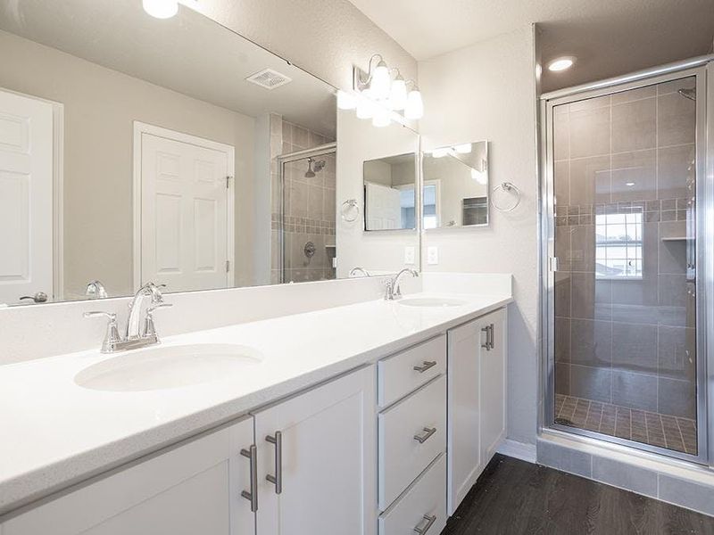 The owner`s suite is complete with a large en-suite bath. The owner`s suite is complete with a large en-suite bath.