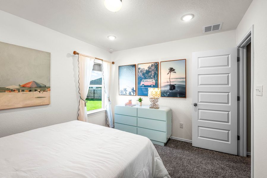 These are the secondary bedrooms of the Hawkins plan and is the model home in Carillon at 13305 Eppright Trace Blvd., Manor, TX. These are the secondary bedrooms of the Hawkins plan and is the model home in Carillon at 13305 Eppright Trace Blvd., Manor, TX.