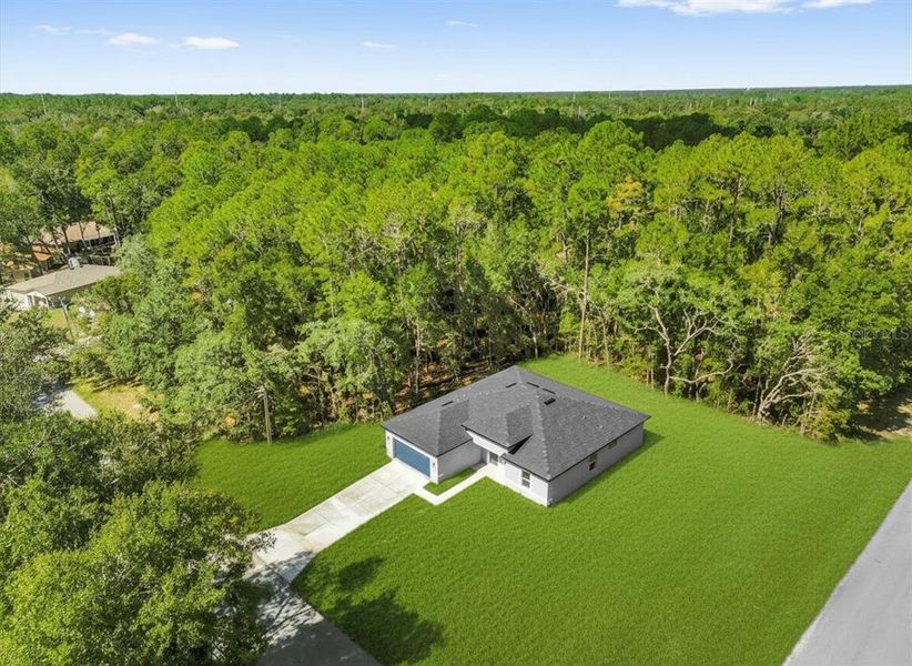 Front exterior of a new home in , Citrus Springs, FL, highlighting curb appeal (Image 21).
