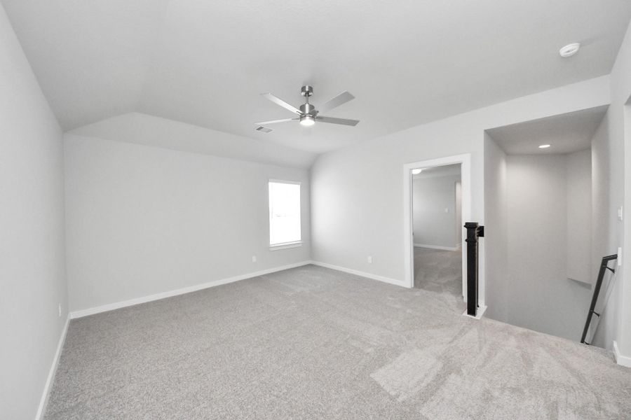 Come upstairs and enjoy a day of leisure in this fabulous game room! This is the perfect hangout spot or adult game room! Features plush carpet, high ceilings, custom paint and windows for plenty of natural light. Come upstairs and enjoy a day of leisure in this fabulous game room! This is the perfect hangout spot or adult game room! Features plush carpet, high ceilings, custom paint and windows for plenty of natural light.