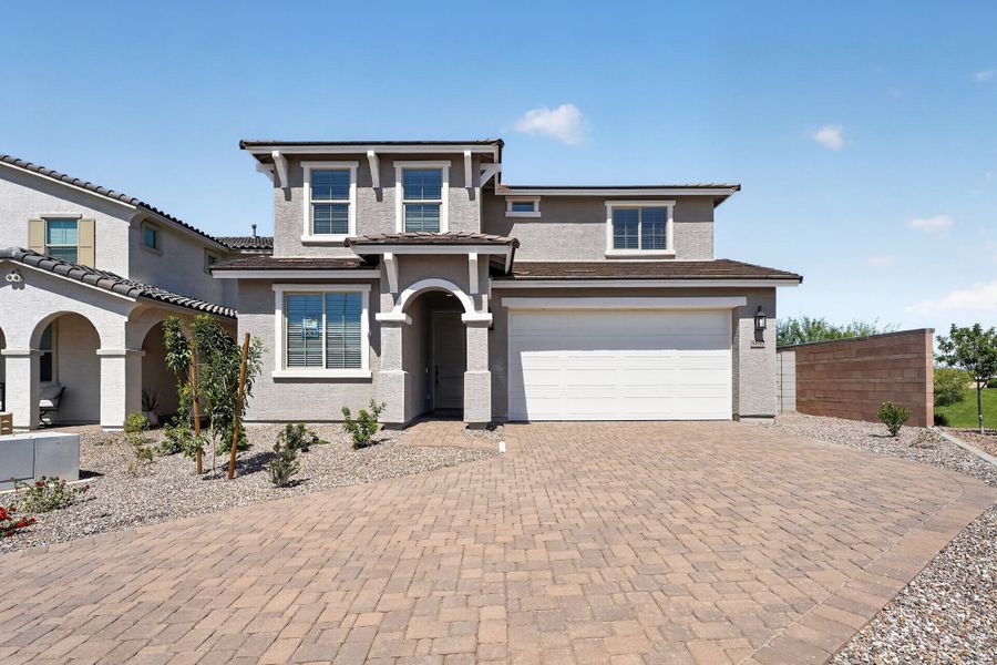 Front exterior of a new home in La Mira, Mesa, AZ, highlighting curb appeal (Image 2). Front exterior of a new home in La Mira, Mesa, AZ, highlighting curb appeal (Image 2).