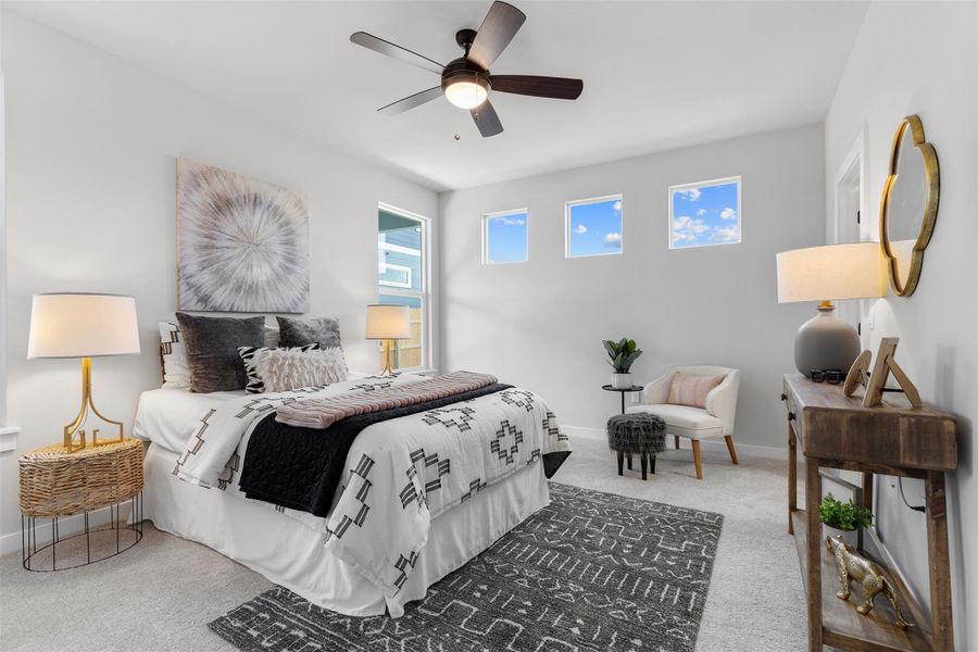 Bedroom featuring light carpet and ceiling fan