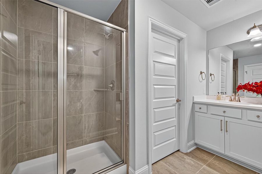 Furnished interior view inside a new home in Sunterra, Katy (Image 10).