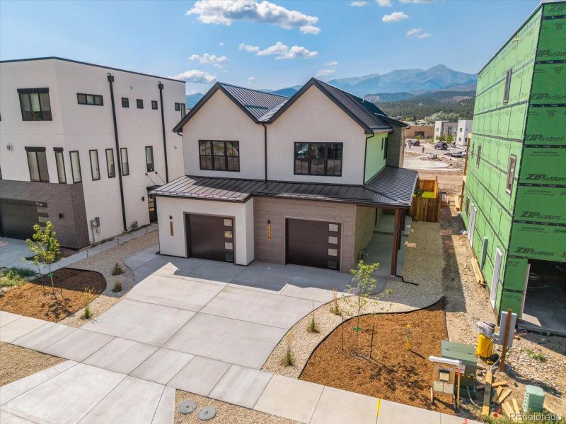 Front exterior of a new home in , Salida, CO, highlighting curb appeal (Image 14).