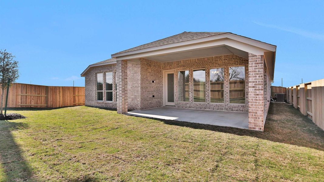 Exterior details and patio area of a home in Meridiana, Manvel (Image 4).