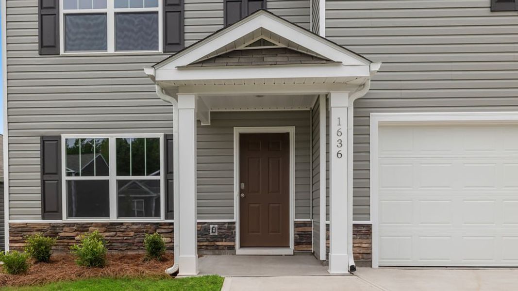 Exterior details and patio area of a home in Treemont Commons, Wellford (Image 3).