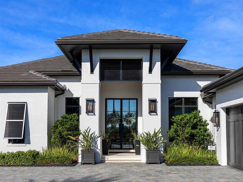 Front exterior of a new home in , Sarasota, FL, highlighting curb appeal (Image 2). Front exterior of a new home in , Sarasota, FL, highlighting curb appeal (Image 2).