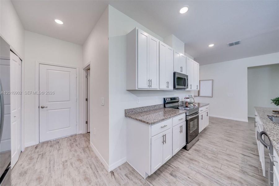 Furnished interior view inside a new home in , Port St. Lucie (Image 44).