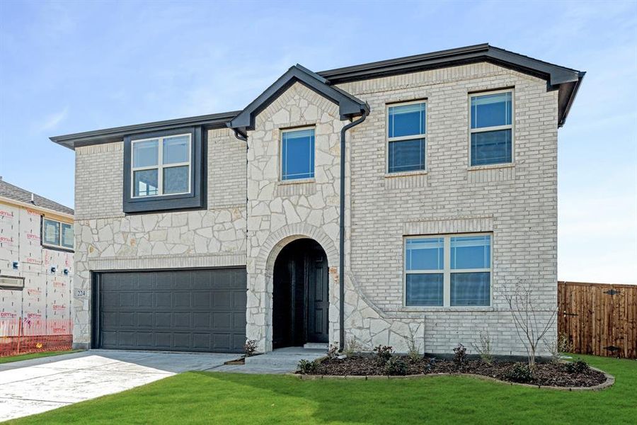 Front exterior of a new home in East Oak Creek Elements, Commerce, TX, highlighting curb appeal (Image 20).