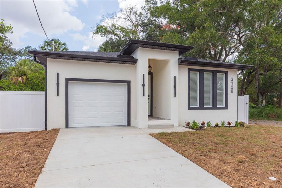 Front exterior of a new home in , Tampa, FL, highlighting curb appeal (Image 1). Front exterior of a new home in , Tampa, FL, highlighting curb appeal (Image 1).