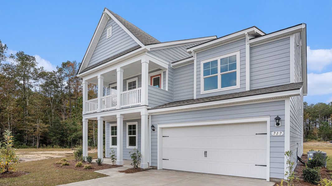 Front exterior of a new home in Brunswick Plantation, Ash, NC, highlighting curb appeal (Image 20).