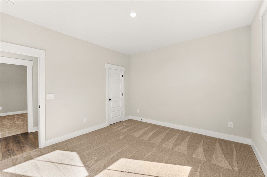 This versatile room features warm carpet flooring
