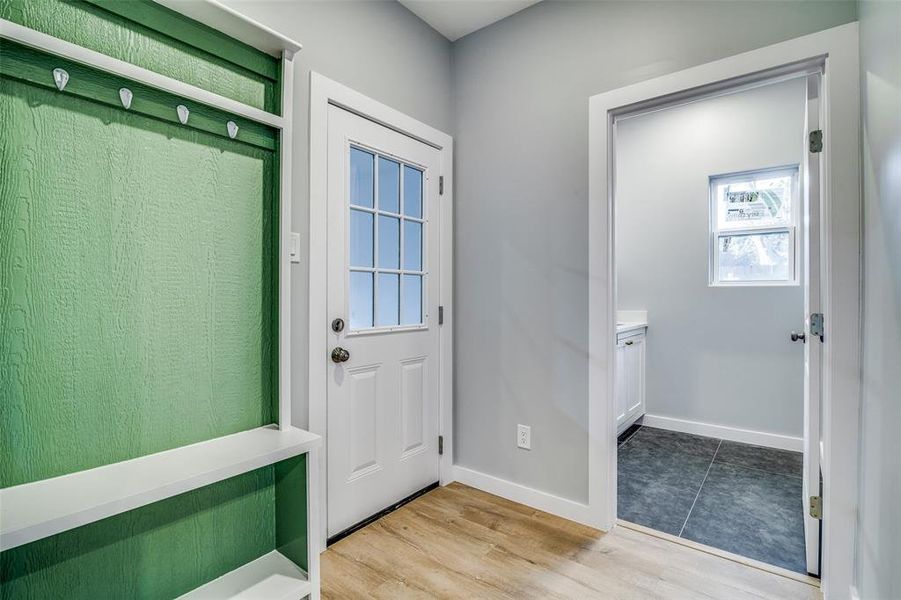 Entryway with light hardwood / wood-style flooring