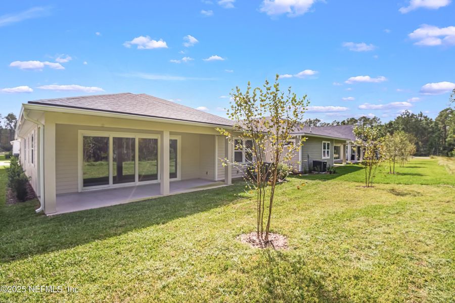 Exterior details and patio area of a home in Coastal Gardens, Palm Coast (Image 1).