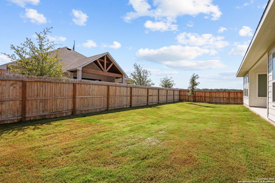 Front exterior of a new home in Megan's Landing, Castroville, TX, highlighting curb appeal (Image 19).
