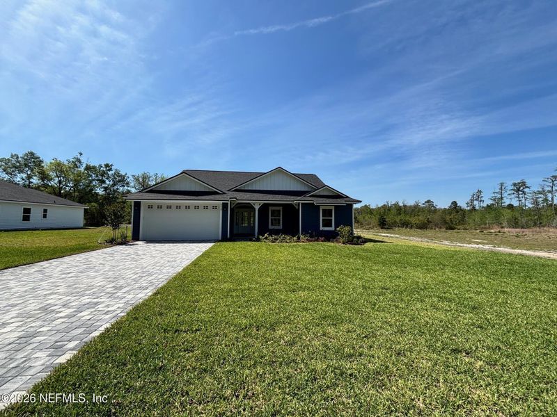 Front exterior of a new home in , Melrose, FL, highlighting curb appeal (Image 14).