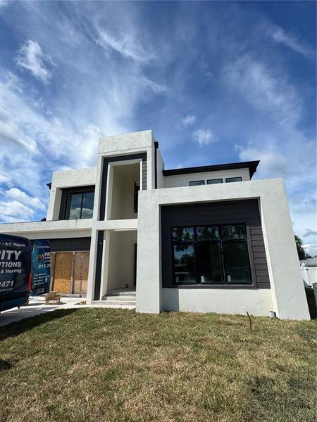 Front exterior of a new home in , Tampa, FL, highlighting curb appeal (Image 23).