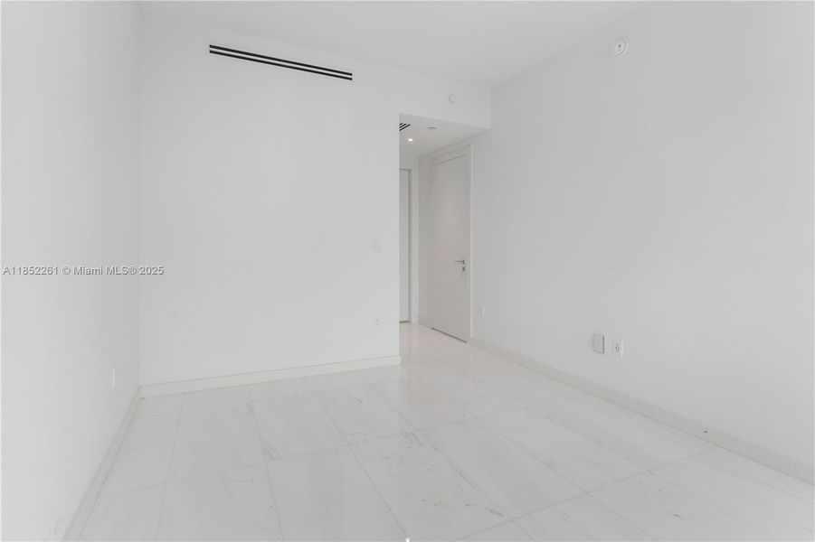 Spacious, unfurnished interior of a new home in Aston Martin Residences, Miami (Image 43).