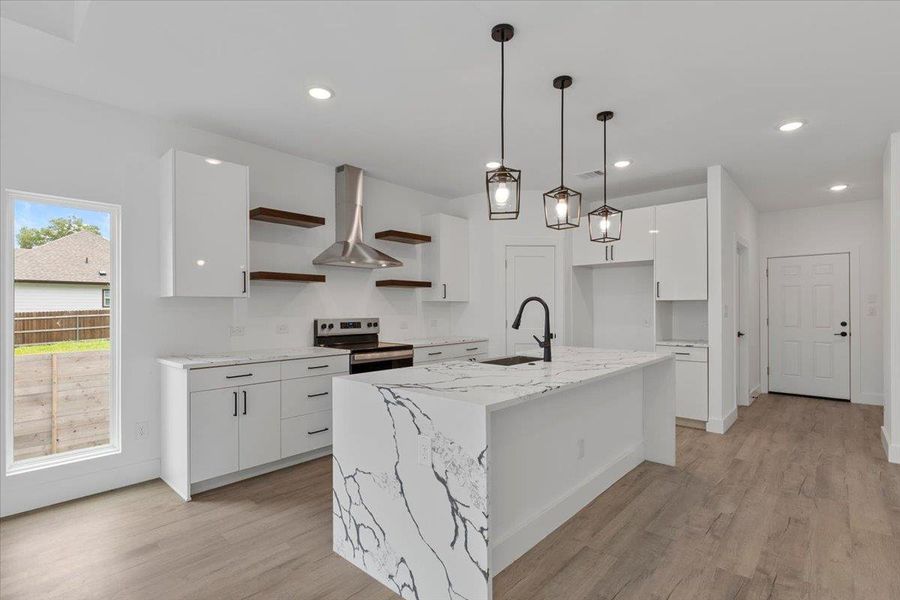 Kitchen with open shelves, stainless steel electric range oven, white cabinets, light wood-style floors, and modern cabinets Kitchen with open shelves, stainless steel electric range oven, white cabinets, light wood-style floors, and modern cabinets