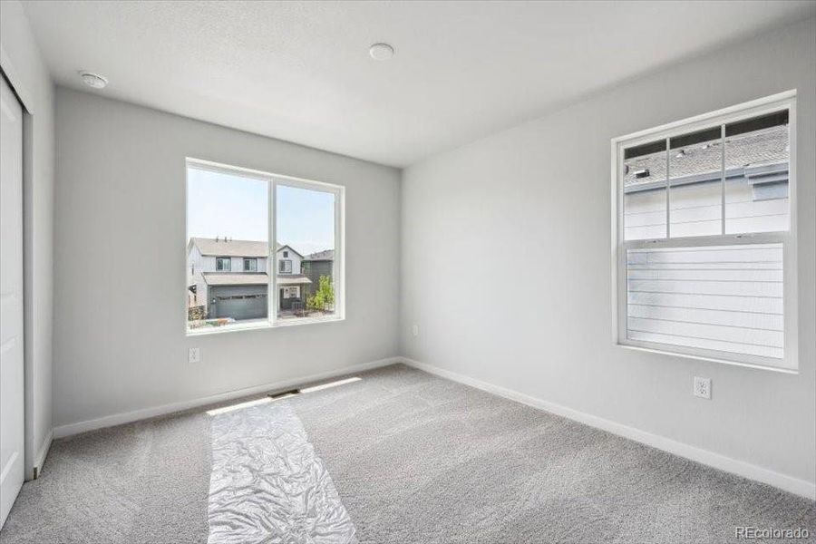 Spacious, unfurnished interior of a new home in Legato, Commerce City (Image 17).