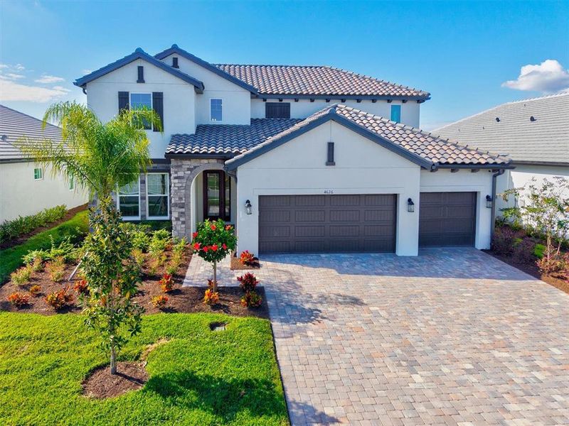 Front exterior of a new home in , Bradenton, FL, highlighting curb appeal (Image 25).