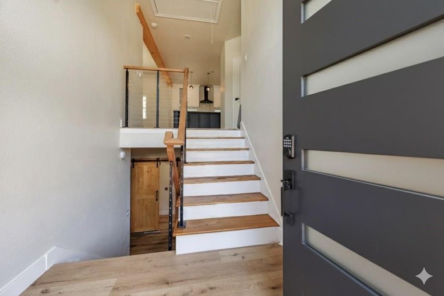 Welcome home! Stairs leading to social areas like the living, dining and kitchen