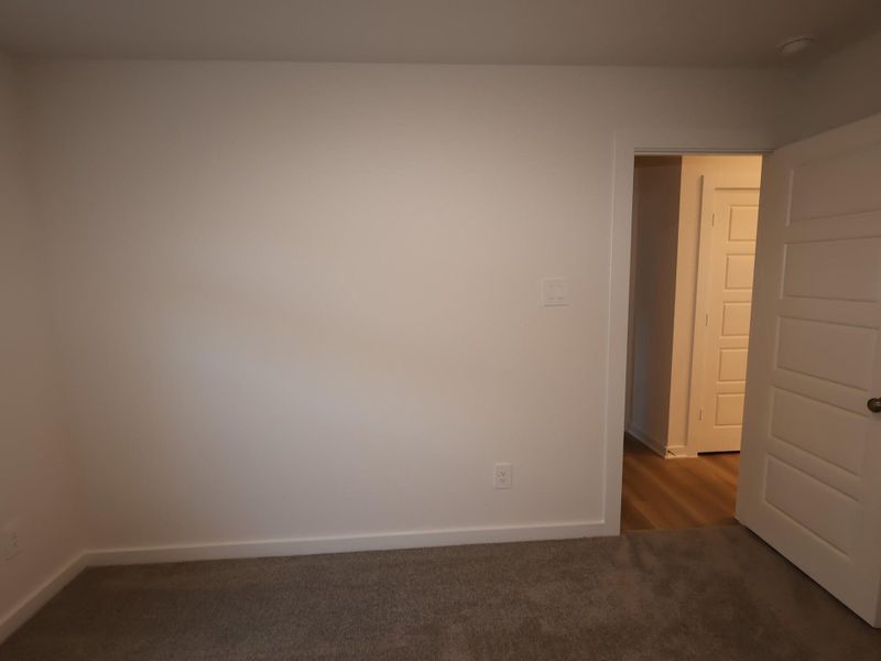 Spacious, unfurnished interior of a new home in Pinewood at Grand Texas, New Caney (Image 30).