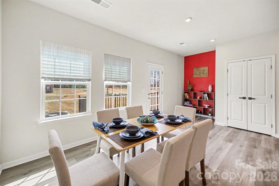 Dining space flows into a nook area and pantry closet.