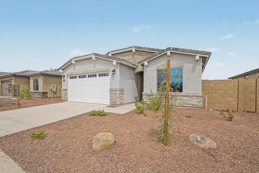 Front exterior of a new home in Avanti at Granite Vista, Waddell, AZ, highlighting curb appeal (Image 2). Front exterior of a new home in Avanti at Granite Vista, Waddell, AZ, highlighting curb appeal (Image 2).