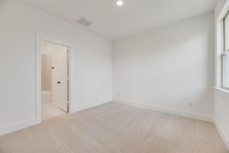 Unfurnished room with light colored carpet and recessed lighting Unfurnished room with light colored carpet and recessed lighting