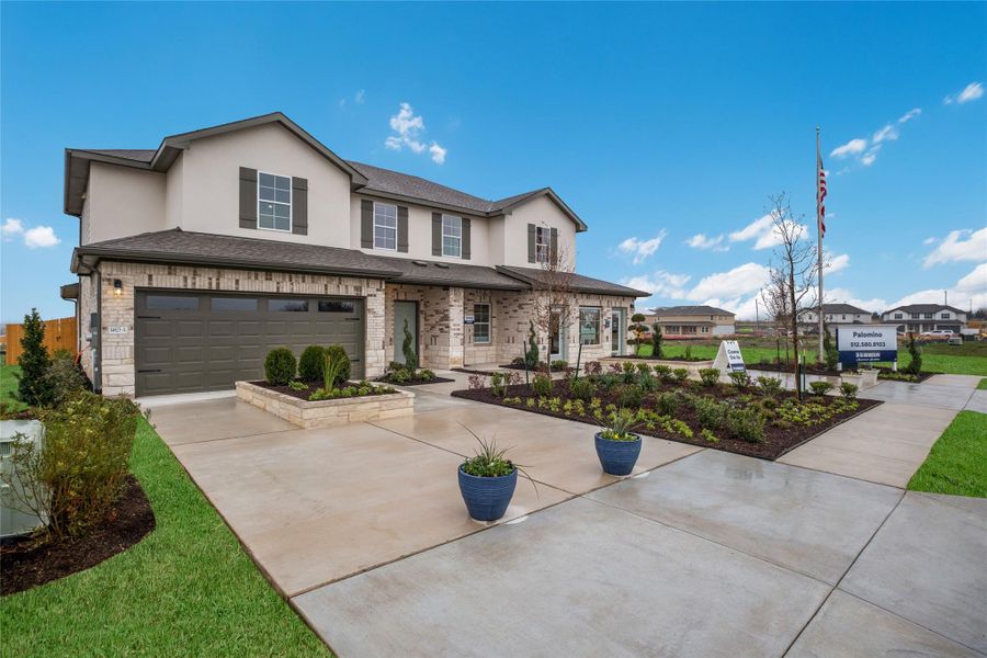 Front exterior of a new home in Palomino, Manor, TX, highlighting curb appeal (Image 2). Front exterior of a new home in Palomino, Manor, TX, highlighting curb appeal (Image 2).