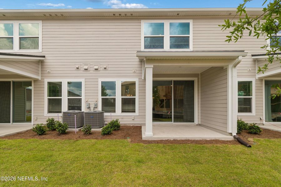 Exterior details and patio area of a home in Westerly Park at Wildlight – Overlook Collection, Yulee (Image 3).
