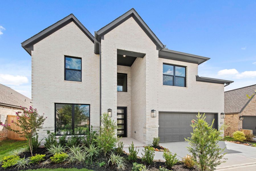 Front exterior of a new home in Grand Central Park – 50', Conroe, TX, highlighting curb appeal (Image 1).
