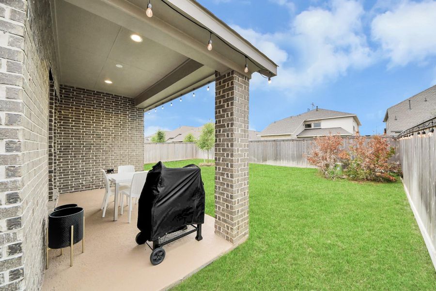 Exterior details and patio area of a home in Bridgeland, Cypress (Image 4). Exterior details and patio area of a home in Bridgeland, Cypress (Image 4).