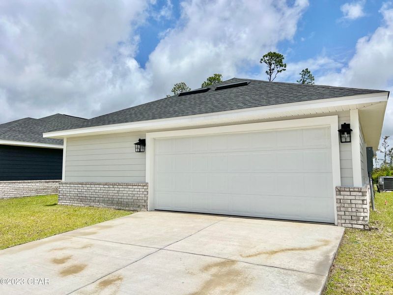Front exterior of a new home in East Bay, Panama City, FL, highlighting curb appeal (Image 2).