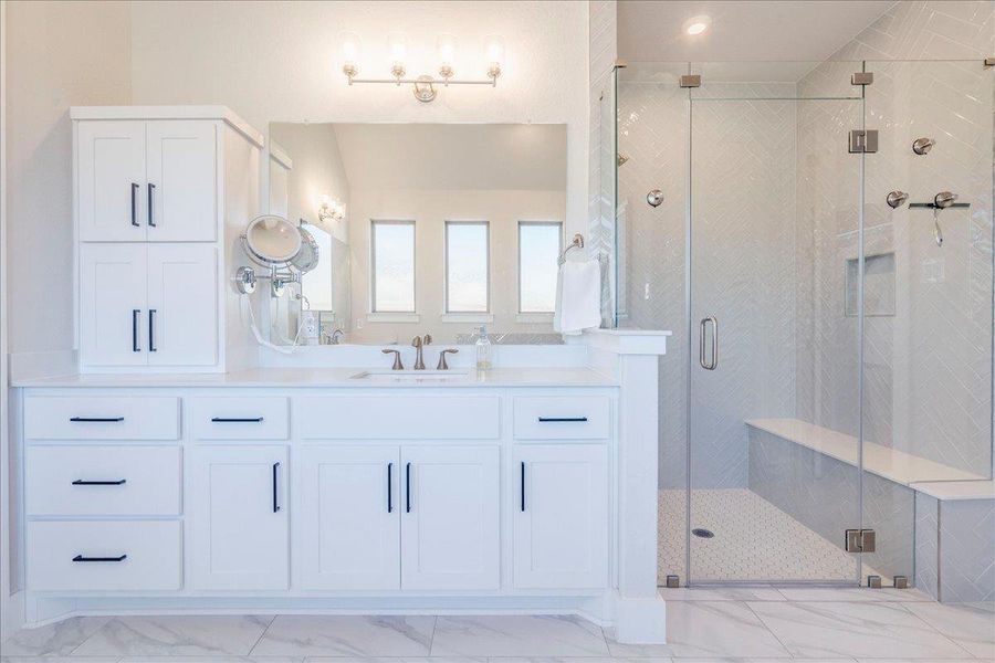 Bathroom with vanity, a shower stall, and light marble finish flooring Bathroom with vanity, a shower stall, and light marble finish flooring