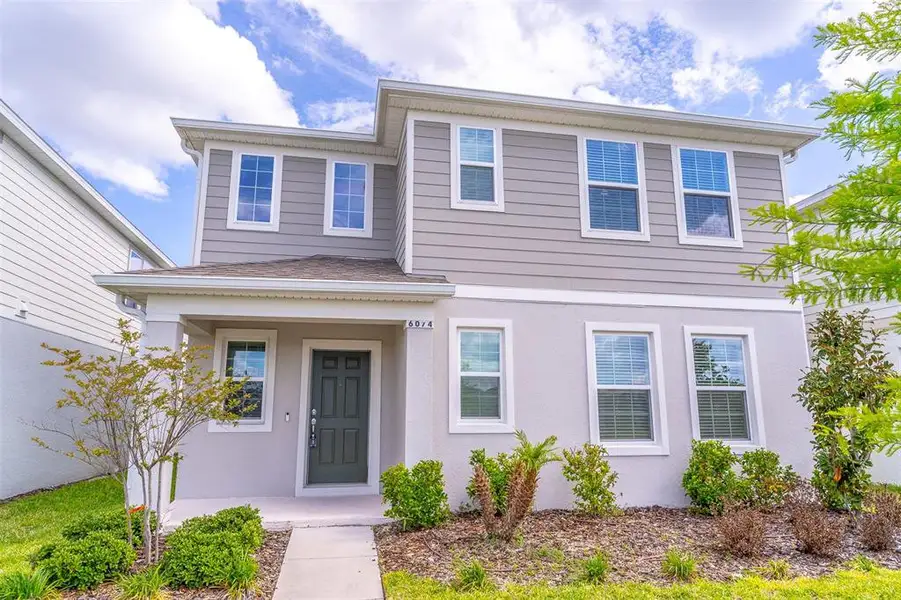 Front exterior of a new home in , St. Cloud, FL, highlighting curb appeal (Image 32).