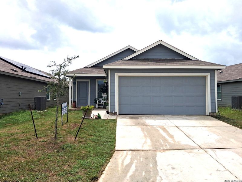 Front exterior of a new home in Stone Garden, Elmendorf, TX, highlighting curb appeal (Image 17).